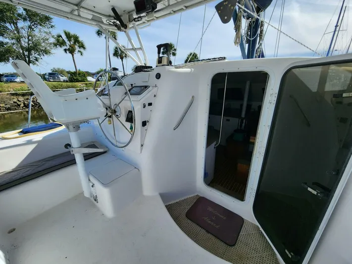  Yacht Photos Pics Manta 42 sailboat cockpit, 2000 model, featuring steering wheel and cabin entrance.