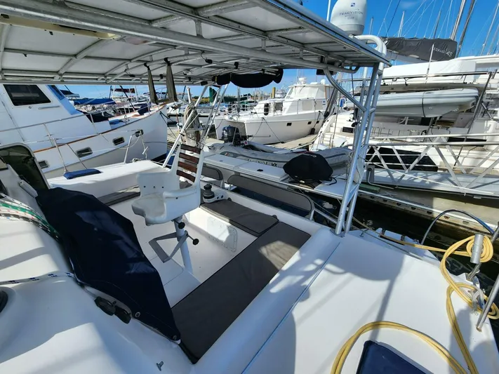  Yacht Photos Pics Manta 42 catamaran, 2000 model, docked in a marina with other boats.