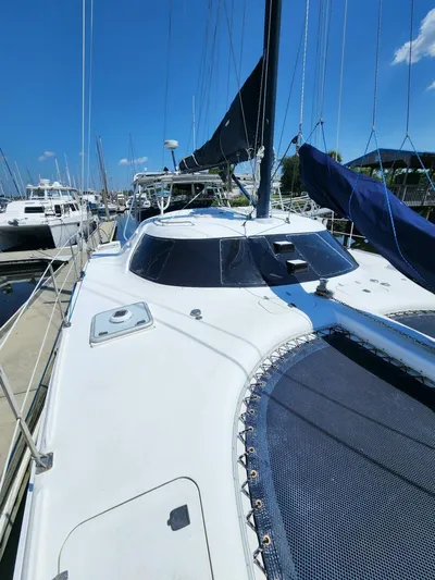  Yacht Photos Pics 2000 Manta 42 sailboat docked at marina under clear blue sky.