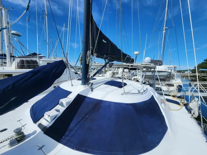 Yacht Photos Pics Sailboat Manta 42, 2000 model, docked at marina under clear blue sky.