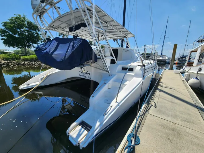  Yacht Photos Pics Manta 42 catamaran docked at marina, 2000 model, sunny day.