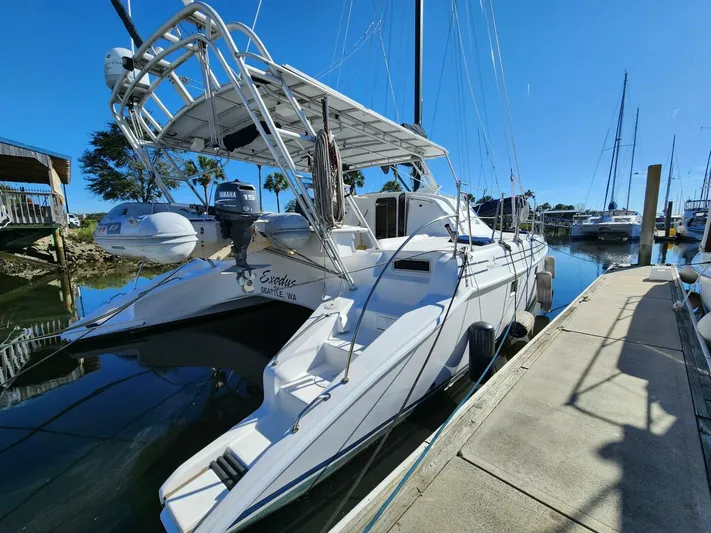  Yacht Photos Pics 2000 Manta 42 catamaran docked at marina under clear blue sky.