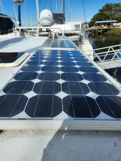  Yacht Photos Pics Solar panel on 2000 Manta 42 catamaran deck, docked by water.