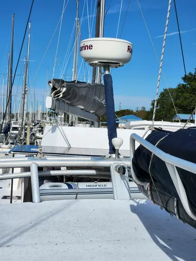  Yacht Photos Pics Sailboat Manta 42, 2000 model, docked in marina with clear blue sky.