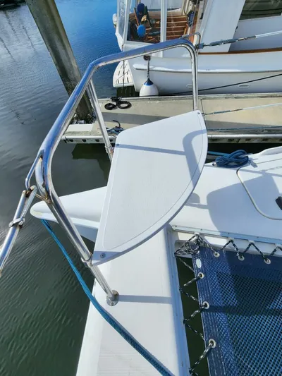  Yacht Photos Pics Manta 42 catamaran bow with stainless steel railing, docked at marina, 2000 model.