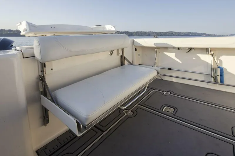 Salt Yacht Photos Pics 2009 Pursuit 345 Offshore OS boat with foldable seating and spacious deck area.