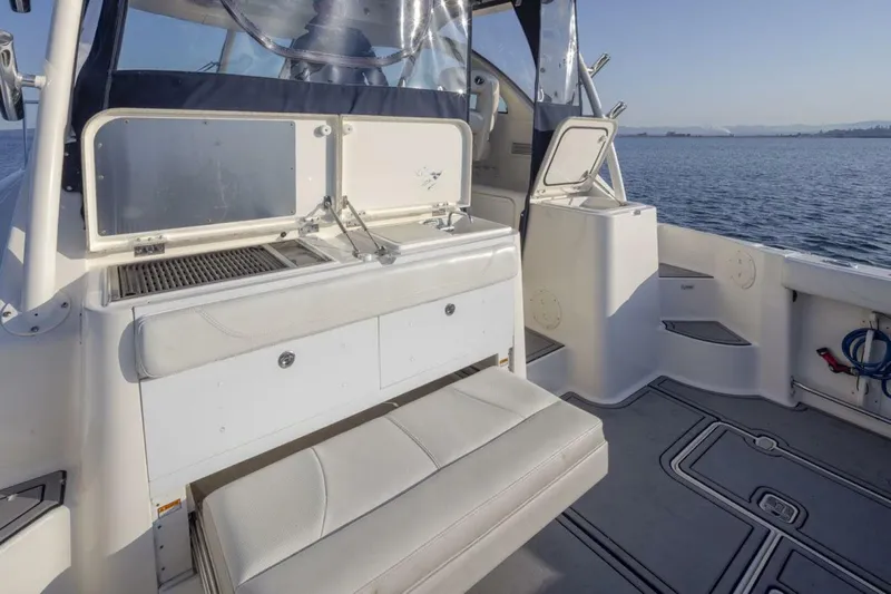 Salt Yacht Photos Pics 2009 Pursuit 345 Offshore OS boat interior with seating and ocean view.