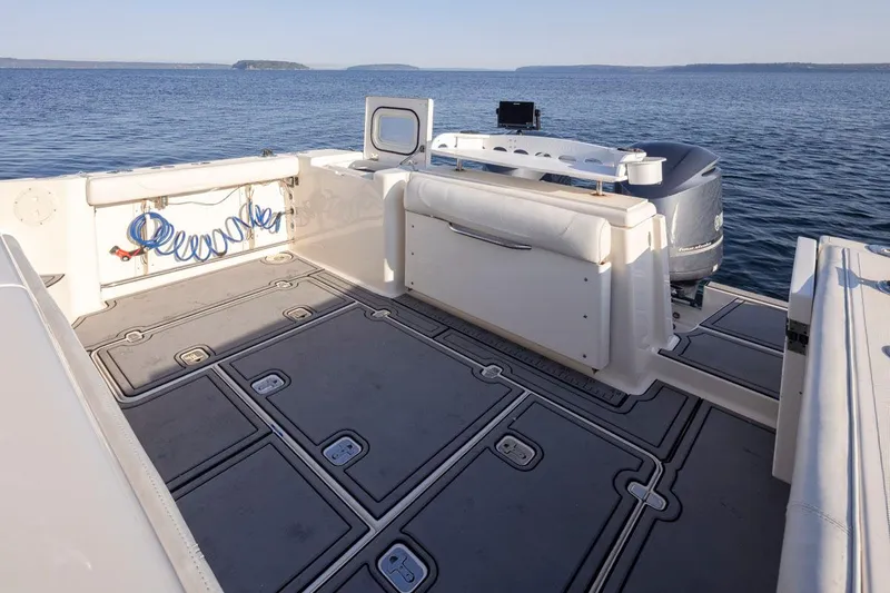 Salt Yacht Photos Pics 2009 Pursuit 345 Offshore OS boat deck with seating, storage, and ocean view.