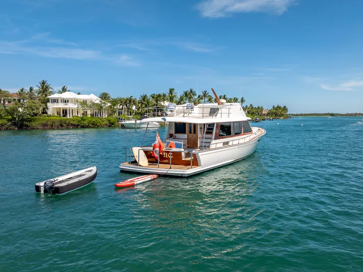 Tonic Yacht Photos Pics 2018 Grand Banks GB60 yacht anchored in scenic tropical waters.
