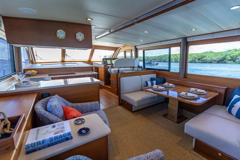 Tonic Yacht Photos Pics Luxurious interior of 2018 Grand Banks GB60 yacht with elegant dining area and scenic views.