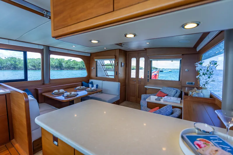 Tonic Yacht Photos Pics Luxurious 2018 Grand Banks GB60 yacht interior with elegant dining and seating area.