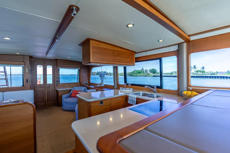 Tonic Yacht Photos Pics Luxurious 2018 Grand Banks GB60 yacht interior with modern kitchen and scenic ocean views.