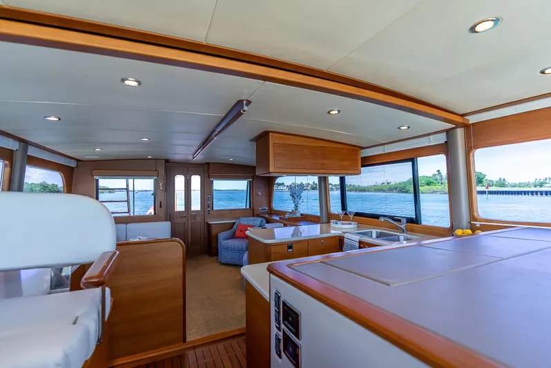 Tonic Yacht Photos Pics Luxurious 2018 Grand Banks GB60 yacht interior with panoramic windows and elegant wood finishes.