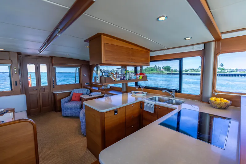 Tonic Yacht Photos Pics Luxurious 2018 Grand Banks GB60 yacht interior with modern kitchen and scenic ocean views.