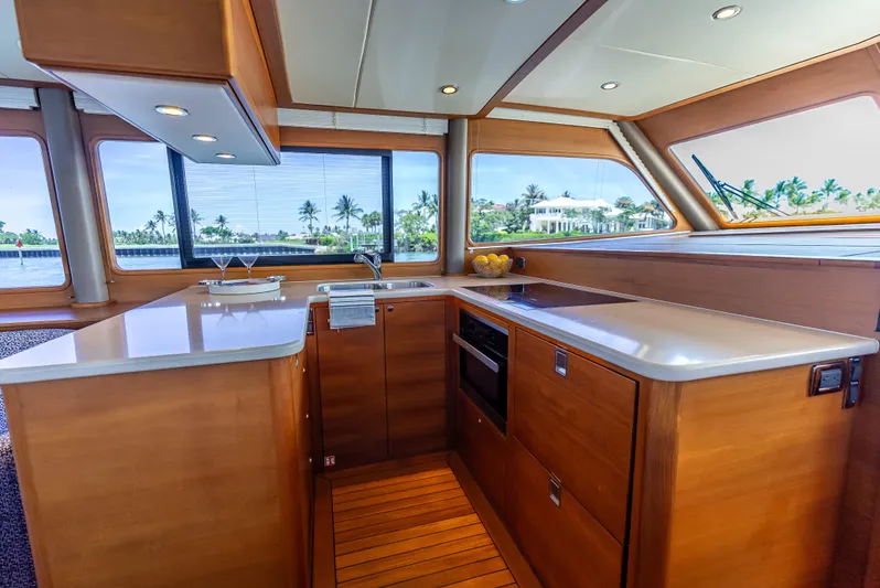 Tonic Yacht Photos Pics Luxurious 2018 Grand Banks GB60 yacht kitchen with modern amenities and scenic window views.
