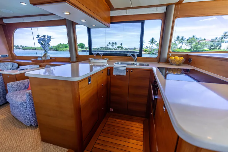 Tonic Yacht Photos Pics Luxurious 2018 Grand Banks GB60 yacht interior with modern kitchen and scenic ocean view.