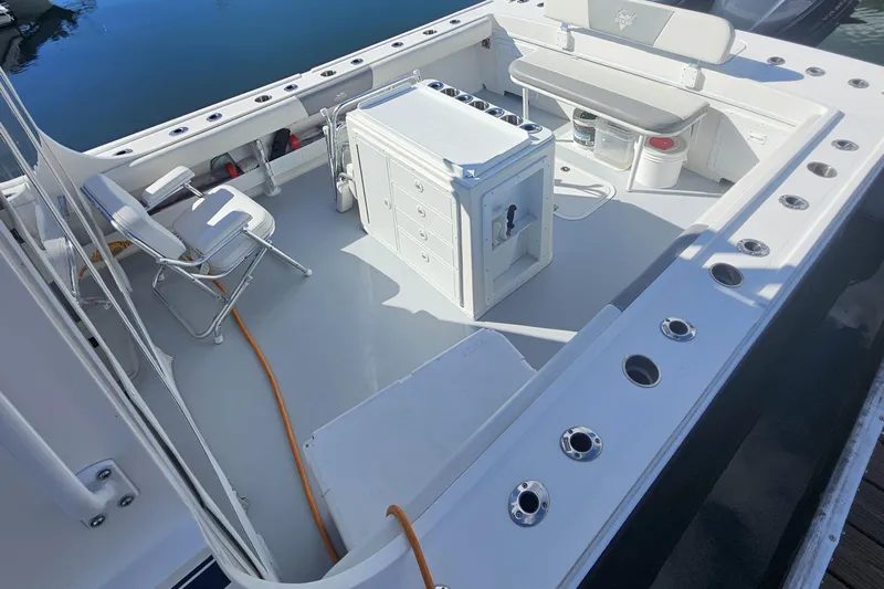  Yacht Photos Pics 2021 Steiger Craft 31 Miami boat deck with seating and storage compartments.