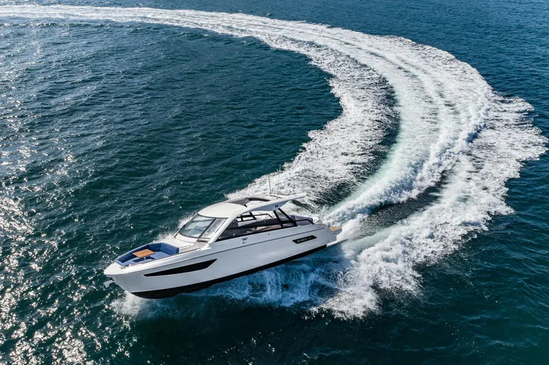 On Its Way Yacht Photos Pics 2024 Bavaria Vida 33 yacht cruising on open water, creating a dynamic wake.