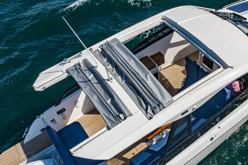On Its Way Yacht Photos Pics 2024 Bavaria Vida 33 yacht with open sunroof cruising on the ocean.