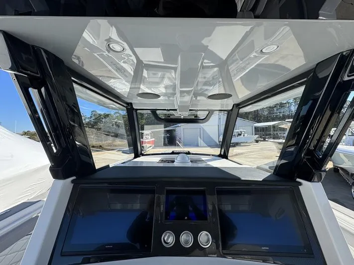  Yacht Photos Pics 2024 Fountain 38 SCX boat dashboard with advanced navigation system.