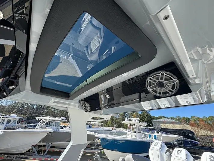  Yacht Photos Pics 2024 Fountain 38 SCX boat interior with skylight and speaker system.