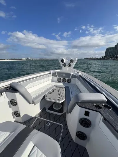  Yacht Photos Pics 2024 Fountain 38 SCX boat interior with seating and ocean view.