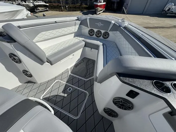  Yacht Photos Pics 2024 Fountain 38 SCX boat interior with luxurious seating and advanced audio system.
