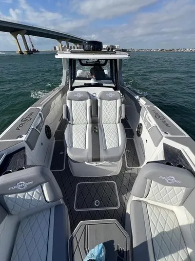  Yacht Photos Pics 2024 Fountain 38 SCX boat interior on the water with bridge in background.