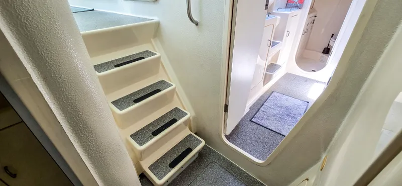 Makai Yacht Photos Pics Staircase and interior view of 1997 Voyage Mayotte 50 yacht.