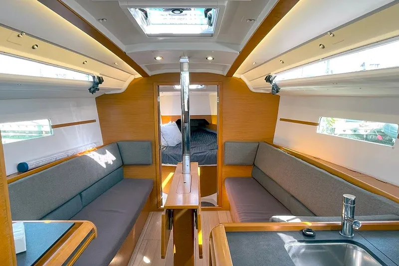 Imagine Yacht Photos Pics Interior of 2017 Jeanneau Sun Odyssey 349 sailboat, featuring cozy seating and modern design.