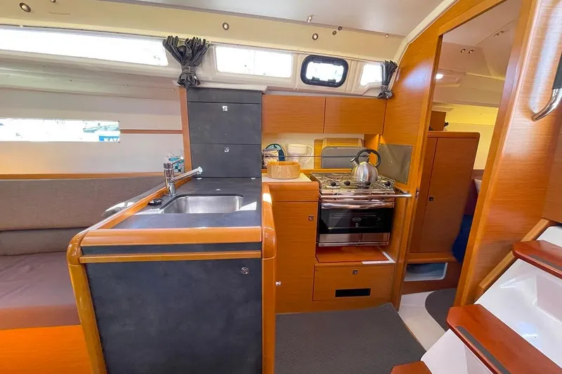 Imagine Yacht Photos Pics Interior of 2017 Jeanneau Sun Odyssey 349 yacht with modern kitchen amenities.