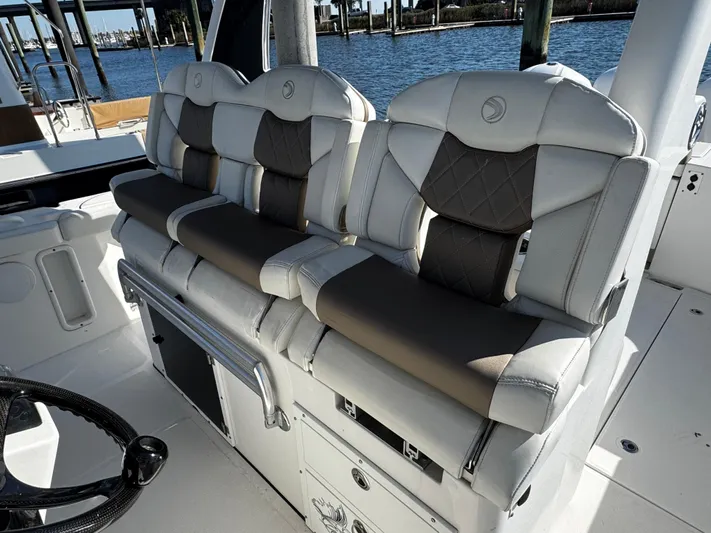 Bali Hai Yacht Photos Pics Luxurious seating on a 2020 Edgewater 370CC boat, featuring plush, cushioned design.