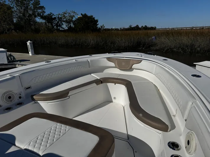 Bali Hai Yacht Photos Pics 2020 Edgewater 370CC boat interior with cushioned seating and sleek design.