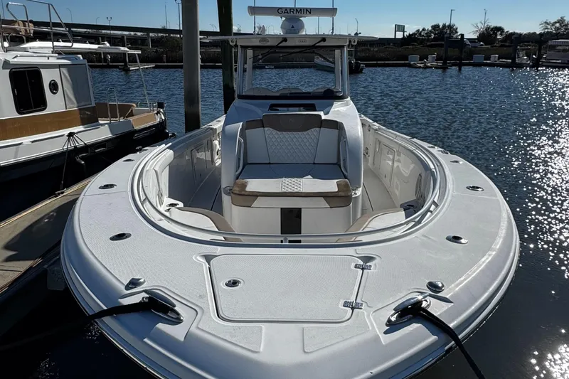 Bali Hai Yacht Photos Pics 2020 Edgewater 370CC boat docked in marina, featuring spacious seating and sleek design.