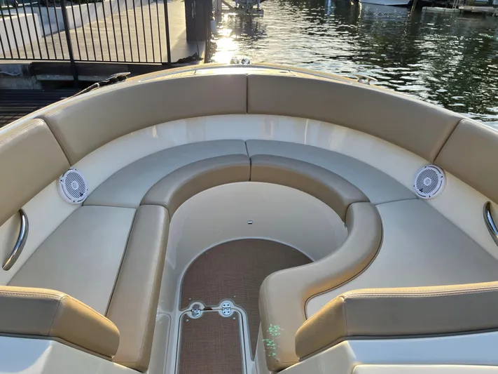 Grato Yacht Photos Pics 2015 Chris-Craft 32 Launch boat interior with beige seating and waterfront view.