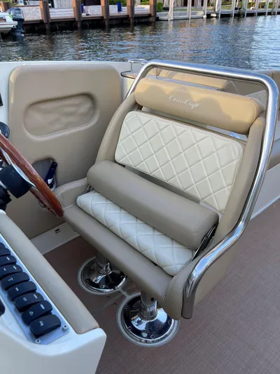 Grato Yacht Photos Pics Luxurious seating on a 2015 Chris-Craft 32 Launch boat, featuring elegant diamond-pattern upholstery.