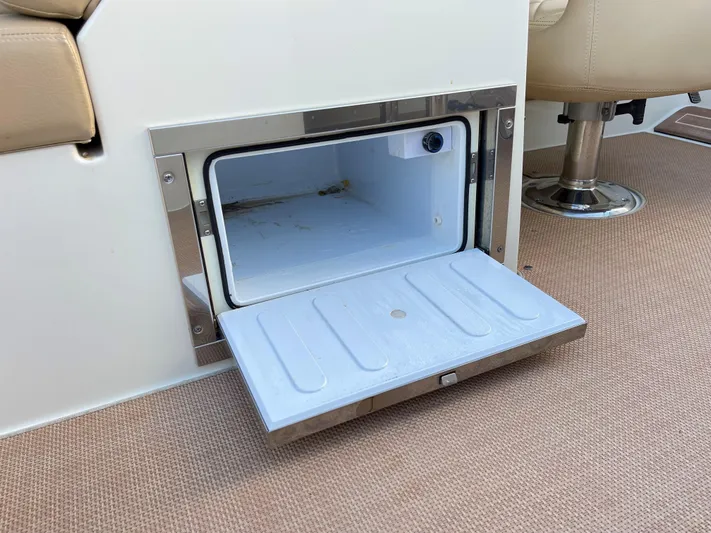 Grato Yacht Photos Pics Open storage compartment on 2015 Chris-Craft 32 Launch boat interior.