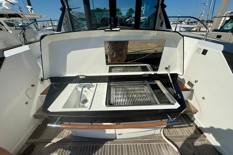 New Trade-in- All Offers & Trades Welcome Yacht Photos Pics Outdoor kitchen on a 2019 Beneteau Gran Turismo 46 yacht, featuring a grill and sink.