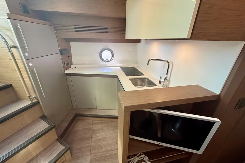 New Trade-in- All Offers & Trades Welcome Yacht Photos Pics 2019 Beneteau Gran Turismo 46 yacht interior kitchen with modern appliances and sleek design.