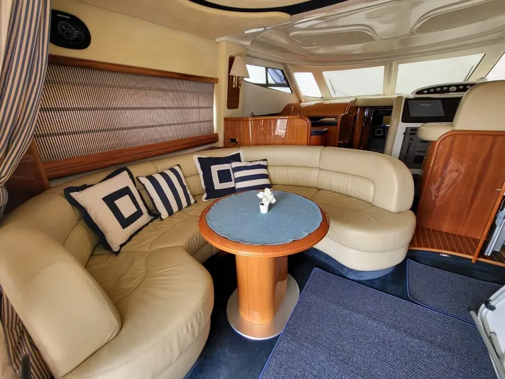  Yacht Photos Pics Luxurious interior of 2006 Cranchi 48 Fly yacht with leather seating and elegant decor.