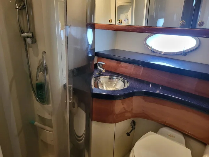  Yacht Photos Pics Luxurious bathroom in 2006 Cranchi 48 Fly yacht with modern fixtures and elegant design.