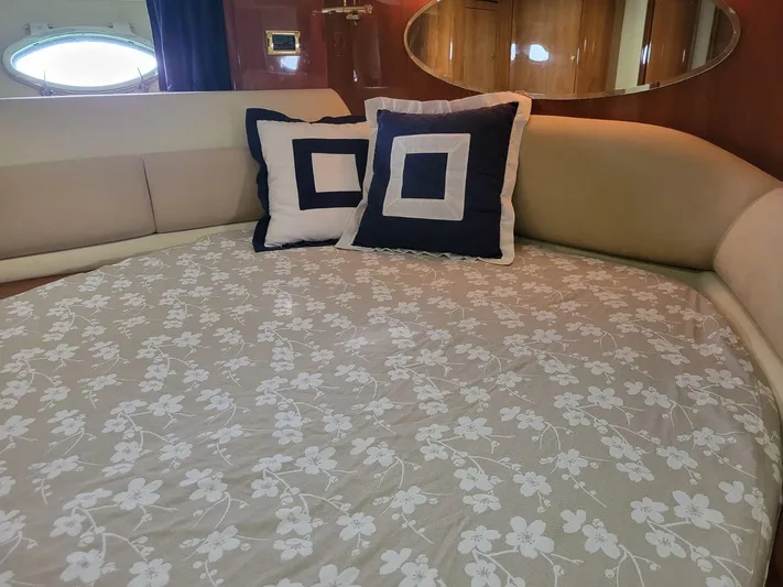  Yacht Photos Pics Luxurious 2006 Cranchi 48 Fly yacht interior with floral bedding and decorative pillows.