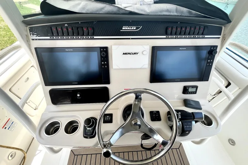  Yacht Photos Pics 2019 Boston Whaler 330 Outrage helm with dual Raymarine displays and Mercury controls.