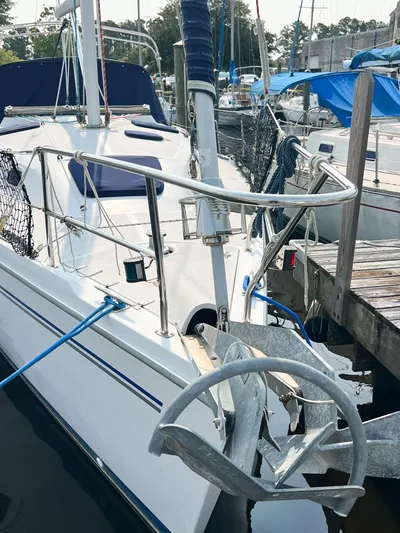 Cheers Yacht Photos Pics 2006 Catalina 350 sailboat docked, featuring anchor and deck details.