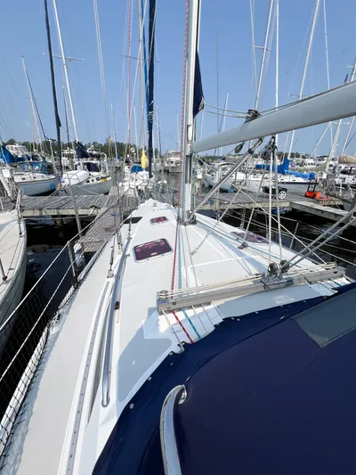 Cheers Yacht Photos Pics 2006 Catalina 350 sailboat docked in marina, surrounded by other boats.
