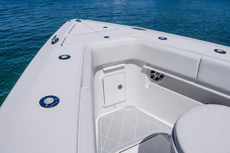 Fear N Money Yacht Photos Pics 2019 Concept 392 ProFish boat deck with storage and seating, on clear blue water.