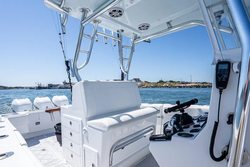 Fear N Money Yacht Photos Pics Interior view of 2019 Concept 392 ProFish boat with fishing equipment and ocean backdrop.