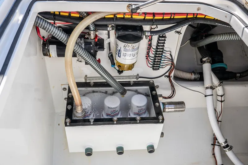 Fear N Money Yacht Photos Pics Engine compartment of 2019 Concept 392 ProFish boat, showcasing wiring and filtration system.