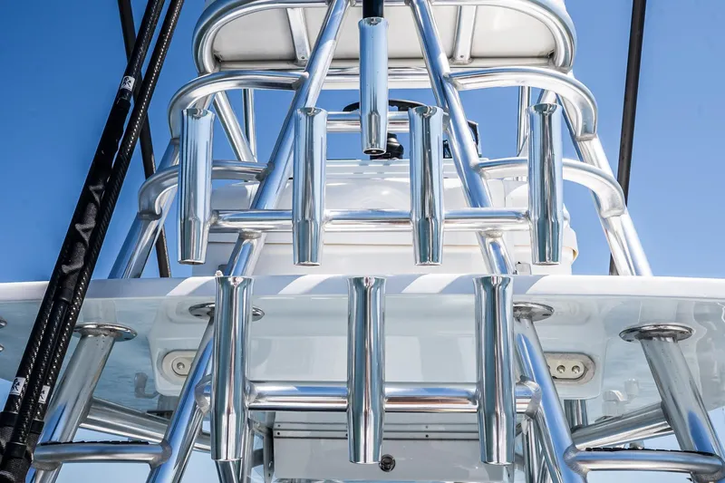 Fear N Money Yacht Photos Pics Chrome rod holders on 2019 Concept 392 ProFish boat against blue sky.