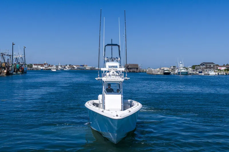 Fear N Money Yacht Photos Pics 2019 Concept 392 ProFish boat navigating a harbor under clear blue skies.